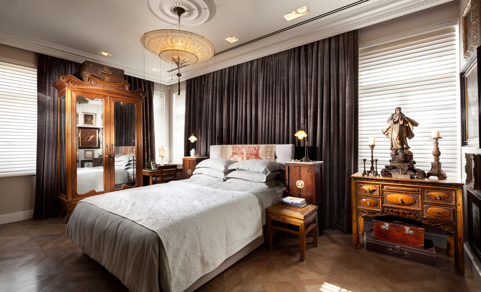 Photo of a contemporary grey and brown bedroom in Other with grey walls and medium hardwood flooring.