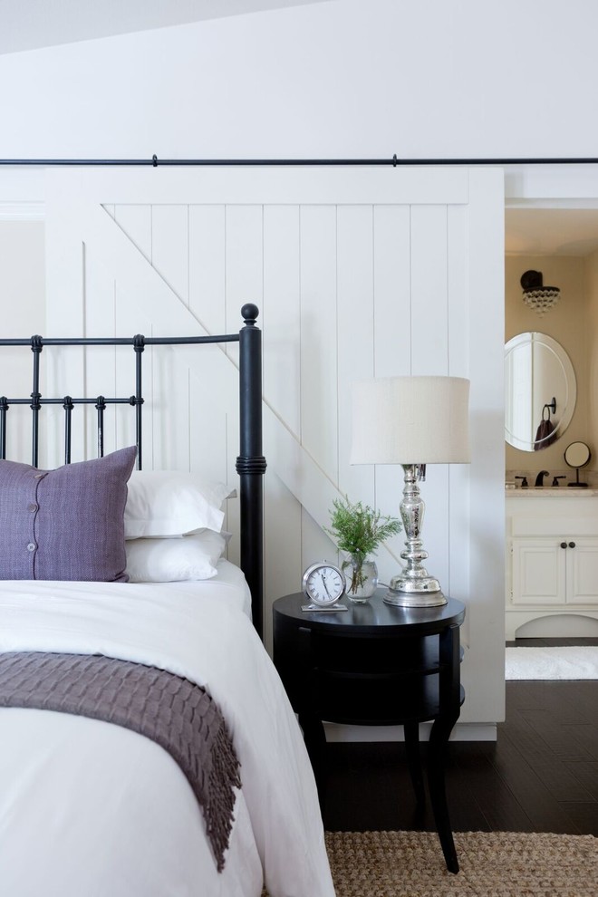 Inspiration for a mid-sized transitional master dark wood floor bedroom remodel in Los Angeles with beige walls and no fireplace
