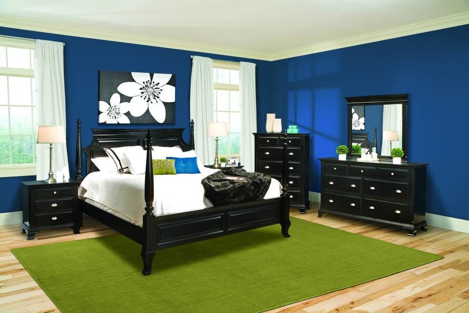 Inspiration for a master medium tone wood floor bedroom remodel in Birmingham with blue walls