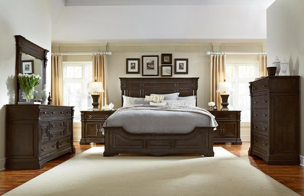 Inspiration for a large mediterranean master medium tone wood floor bedroom remodel in Indianapolis with beige walls and no fireplace
