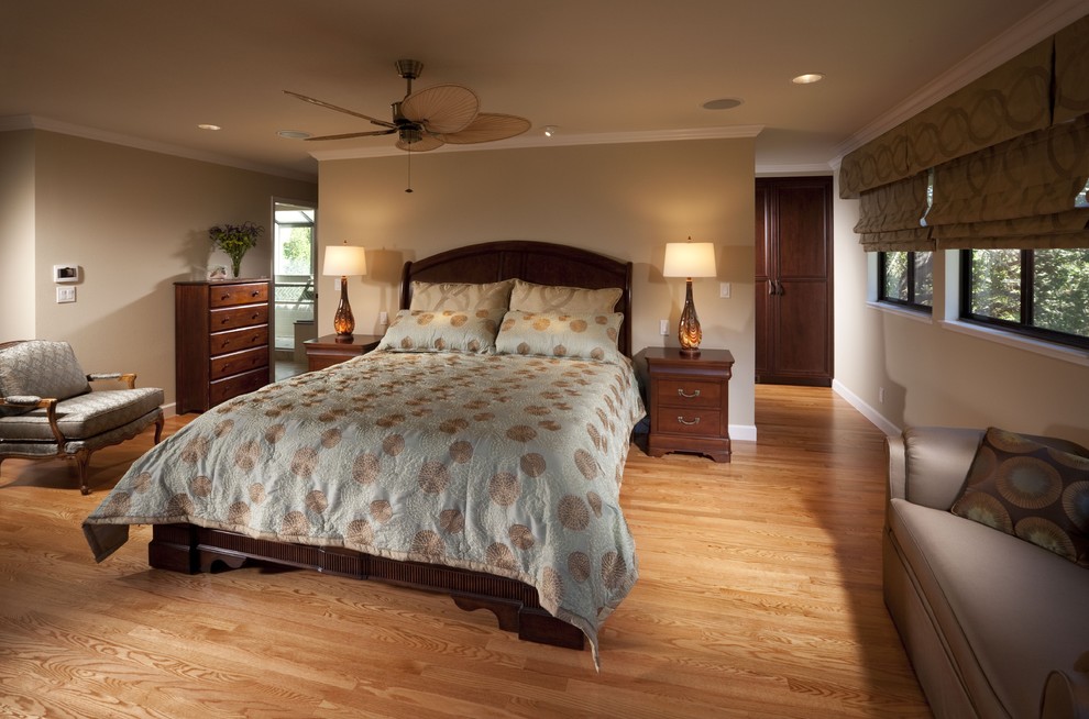 Design ideas for a contemporary bedroom in San Francisco with beige walls and medium hardwood flooring.