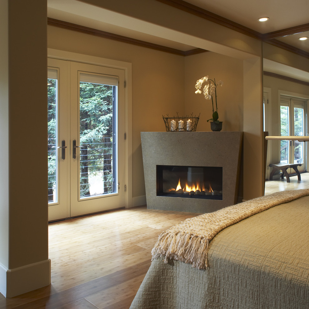 Example of a trendy bedroom design in San Francisco with a corner fireplace