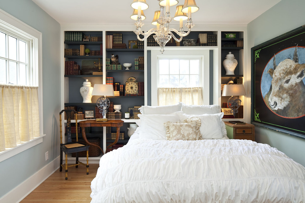 Inspiration for a timeless guest light wood floor bedroom remodel in Minneapolis with blue walls and no fireplace
