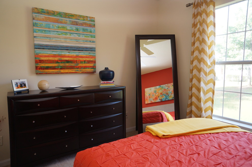 This is an example of a medium sized contemporary bedroom in Tampa with beige walls.