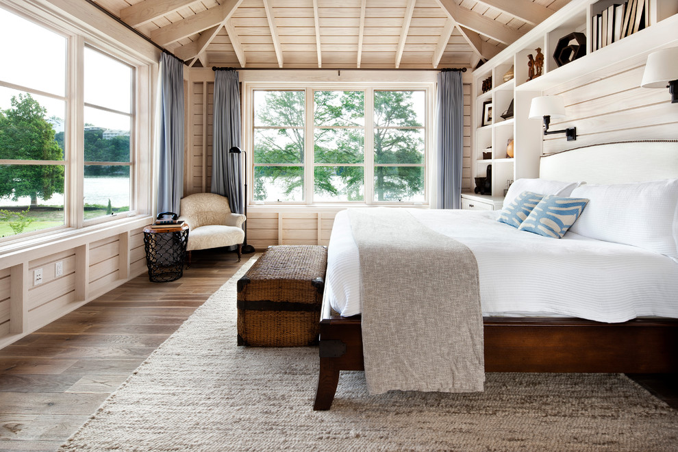 Elegant light wood floor bedroom photo in Austin