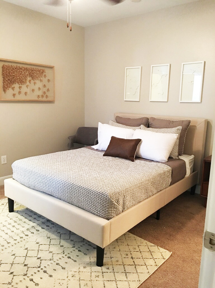 Inspiration for a small transitional guest carpeted and beige floor bedroom remodel in New Orleans with beige walls