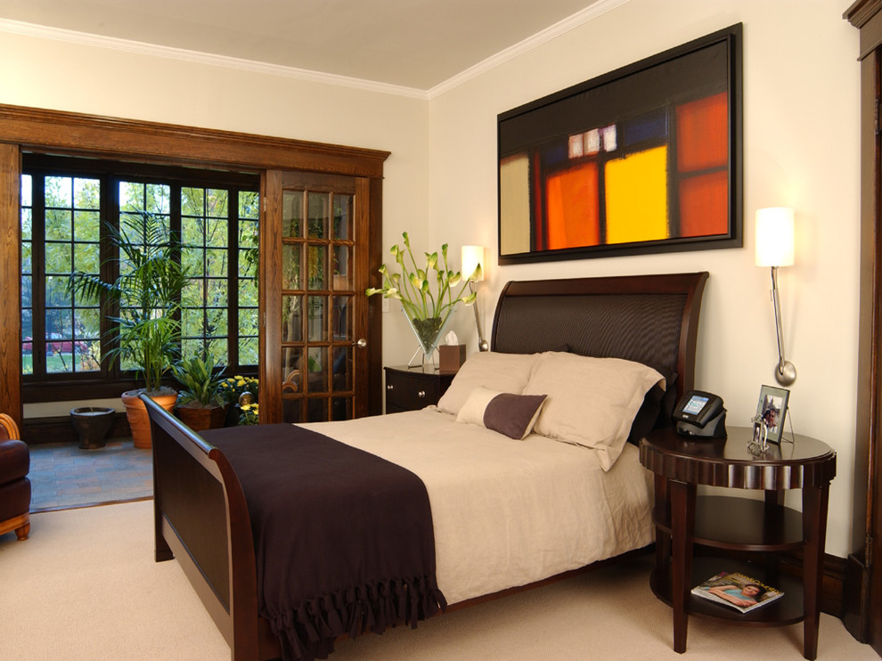 Inspiration for a contemporary carpeted bedroom remodel in Columbus with beige walls