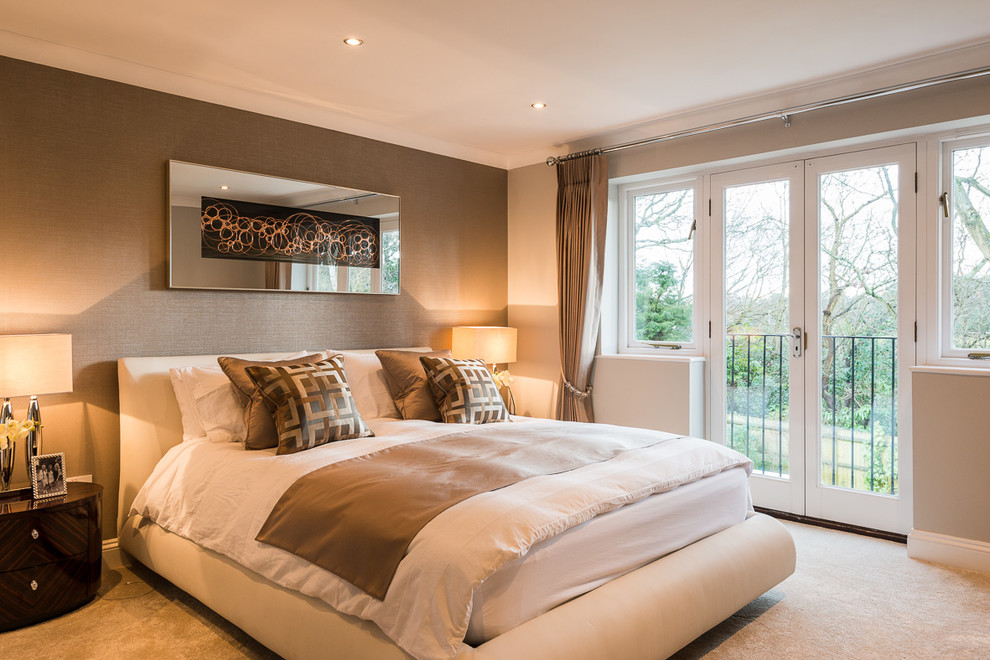Medium sized contemporary master bedroom in Berkshire with brown walls and carpet.