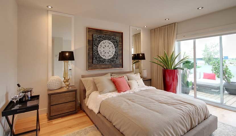 Inspiration for a medium sized contemporary master bedroom in Montreal with white walls, light hardwood flooring, no fireplace and beige floors.