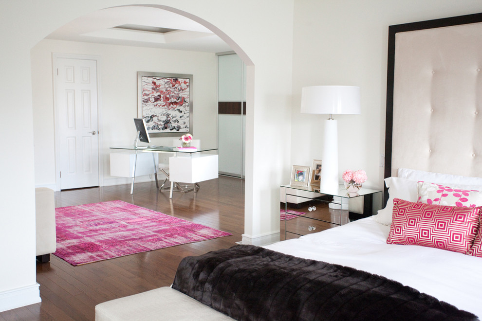 Example of a trendy master medium tone wood floor bedroom design in Toronto with white walls and no fireplace