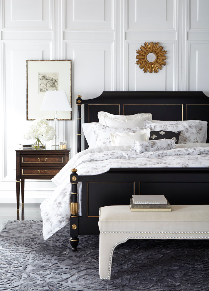 Imagen de dormitorio principal clásico renovado de tamaño medio sin chimenea con paredes blancas y suelo gris