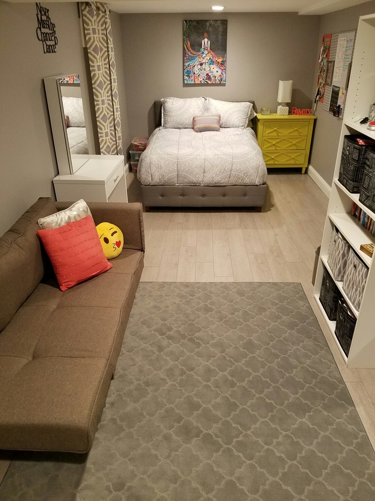 Inspiration for a mid-sized contemporary guest laminate floor bedroom remodel in Bridgeport with gray walls and no fireplace