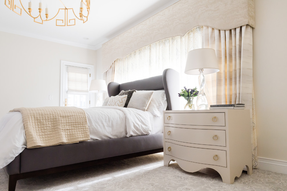 Large traditional master bedroom in Cleveland with beige walls, carpet, a standard fireplace, a tiled fireplace surround and grey floors.