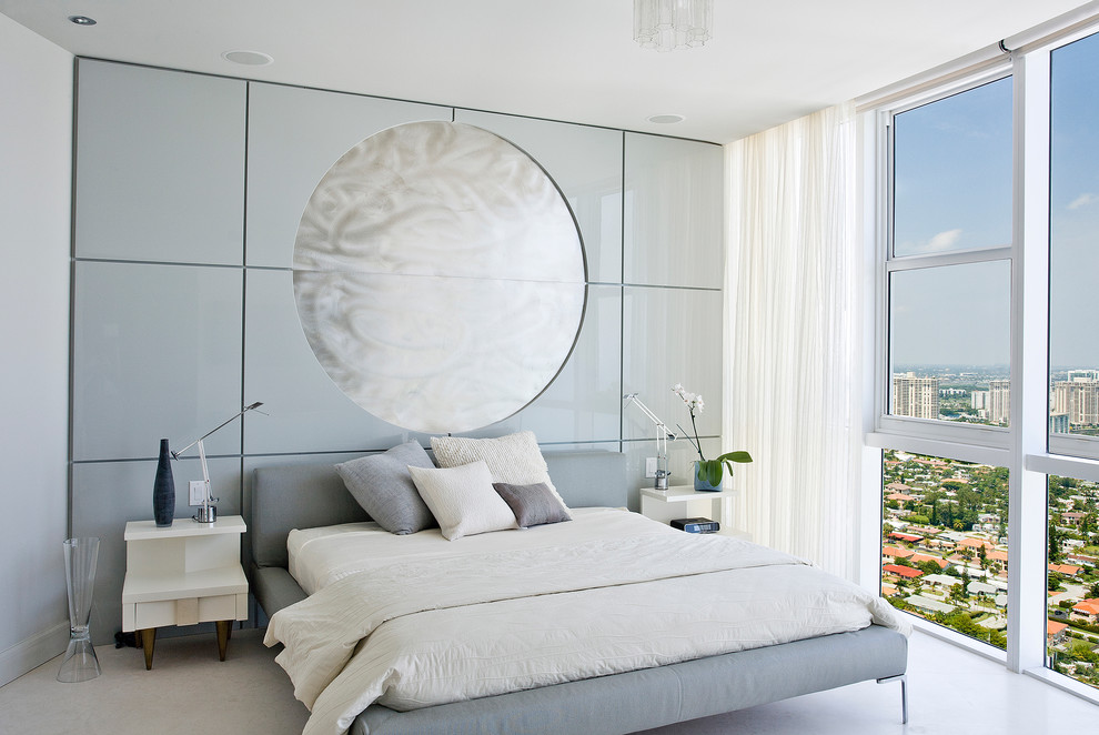Photo of a contemporary bedroom in Other with grey walls and a feature wall.