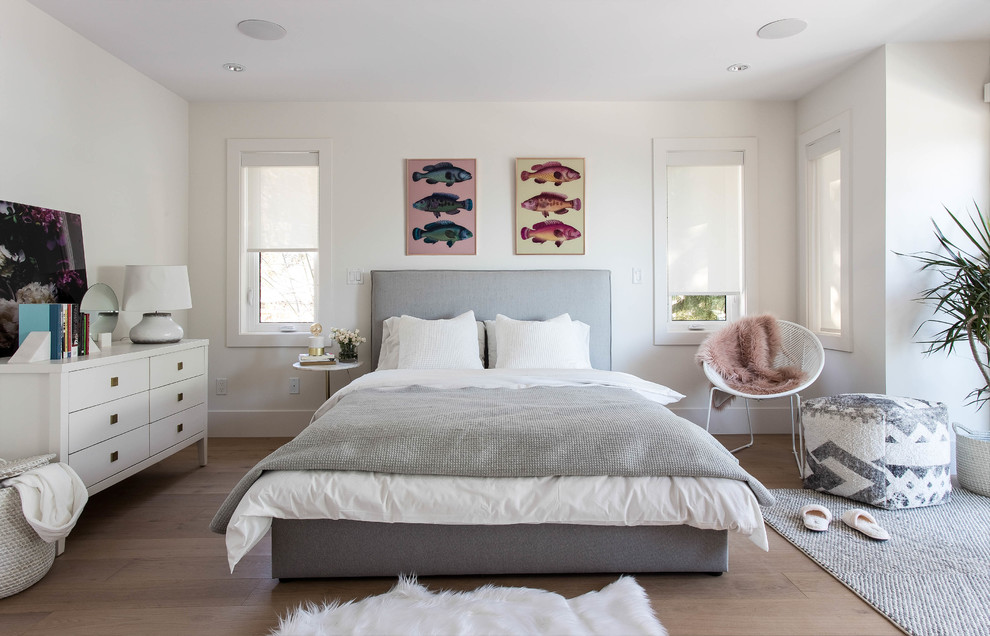 Inspiration for a mid-sized contemporary guest light wood floor and beige floor bedroom remodel in Vancouver with white walls and no fireplace