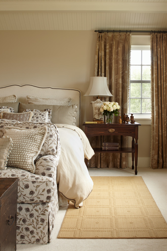 Example of a country carpeted bedroom design in Denver with beige walls