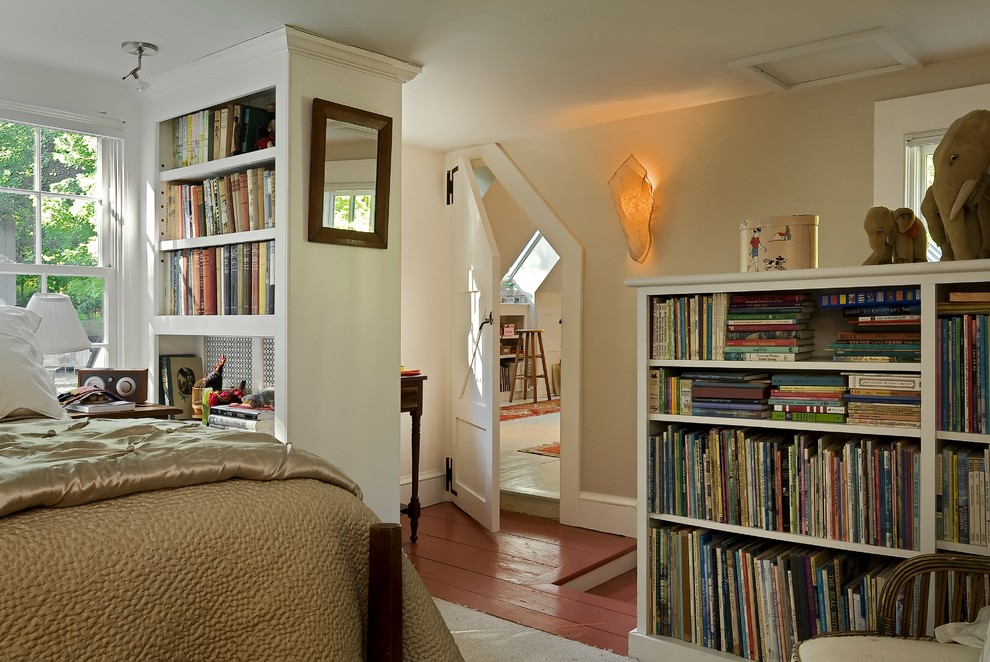Example of a classic red floor bedroom design in Burlington with beige walls