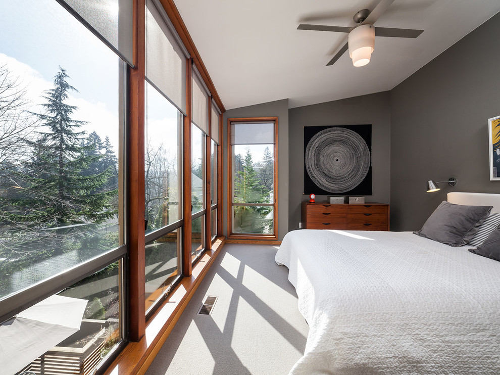 Photo of a contemporary bedroom in Portland with grey walls, carpet and no fireplace.