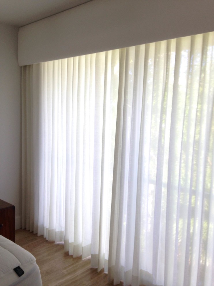 Bedroom with upholstered cornice with traversing sheer drapery - Modern ...