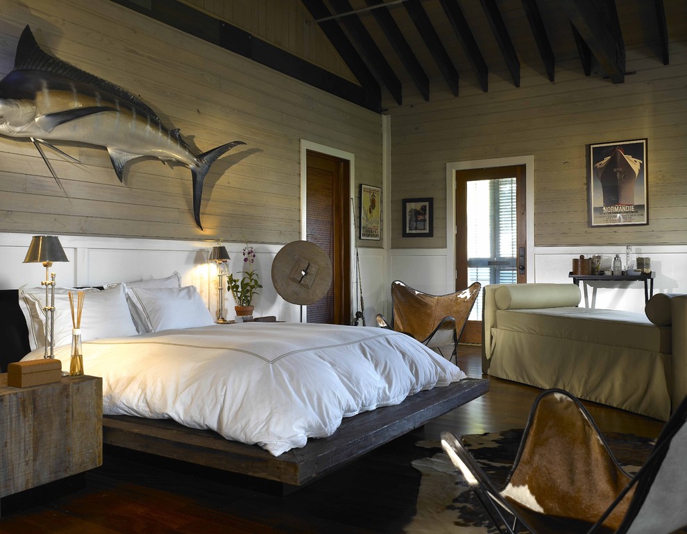 Example of a mid-sized eclectic master dark wood floor bedroom design in Miami with beige walls