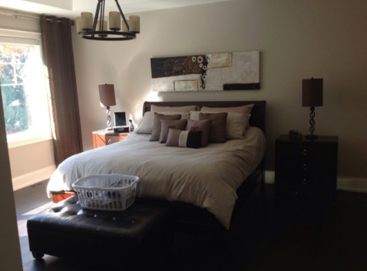 Dark wood floor bedroom photo in Toronto with beige walls