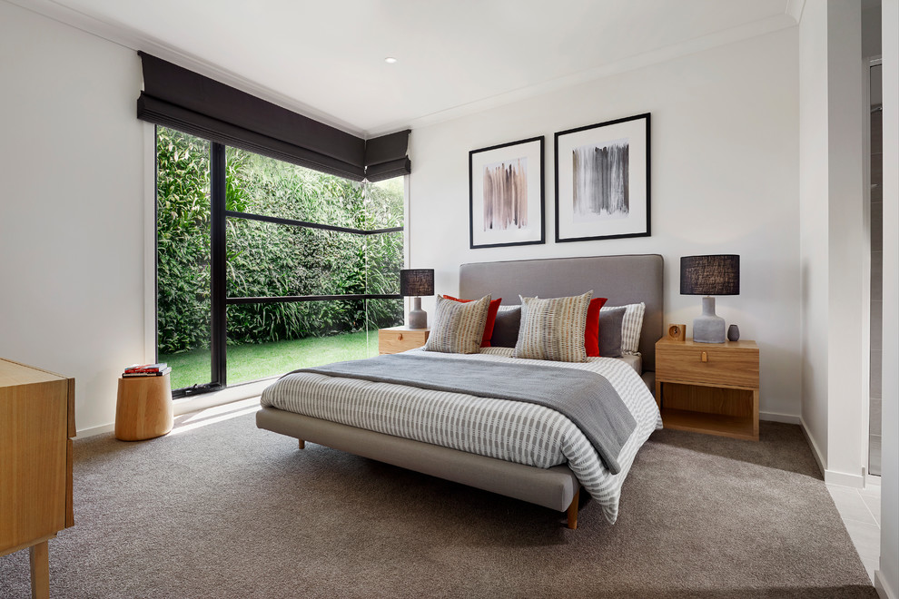 Example of a trendy carpeted and gray floor bedroom design in Melbourne with white walls