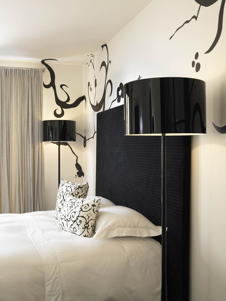 Minimalist bedroom photo in San Diego with white walls