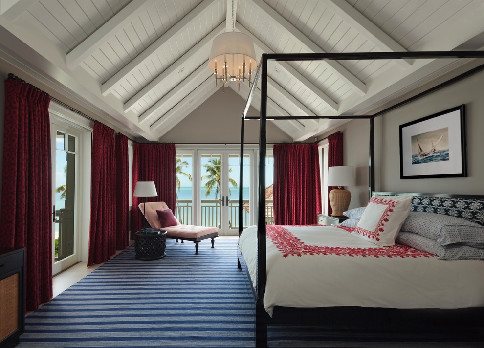 Bedroom - large coastal master bedroom idea in Miami with white walls