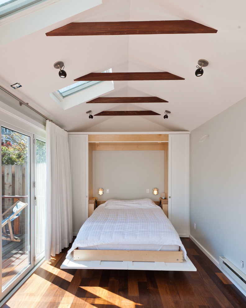 Inspiration for a contemporary guest dark wood floor bedroom remodel in San Francisco with white walls and no fireplace