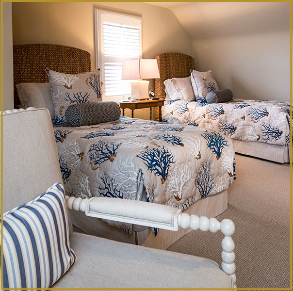 Design ideas for a medium sized coastal guest bedroom in New York with carpet, no fireplace, beige walls, beige floors and feature lighting.