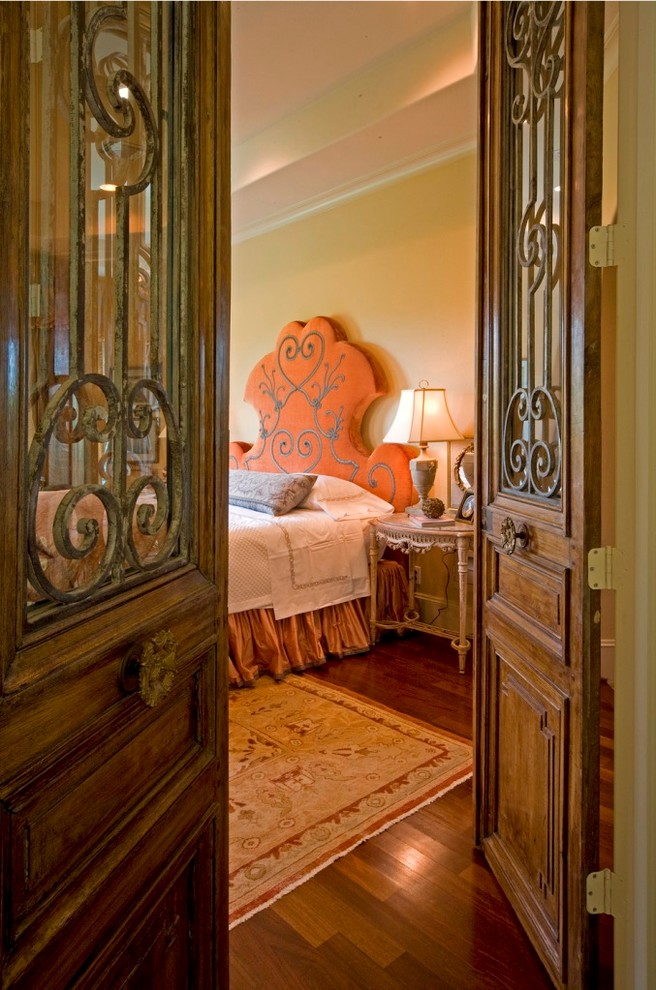 Medium sized classic master bedroom in Houston with beige walls and medium hardwood flooring.
