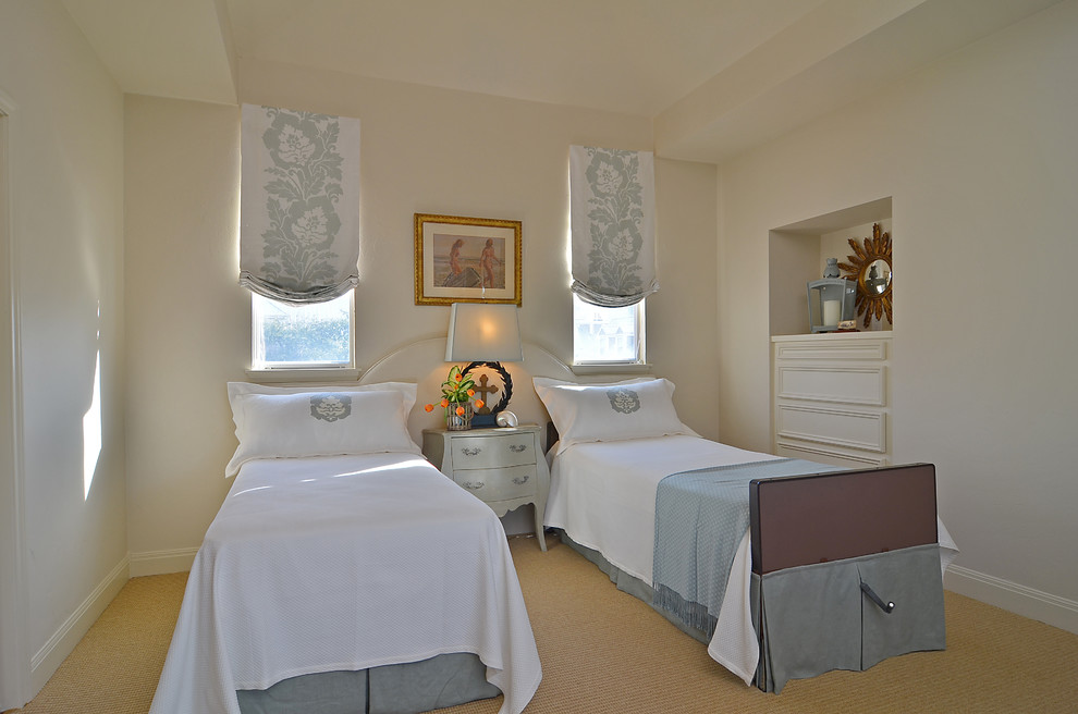 Example of a mid-sized classic guest carpeted bedroom design in Houston with beige walls