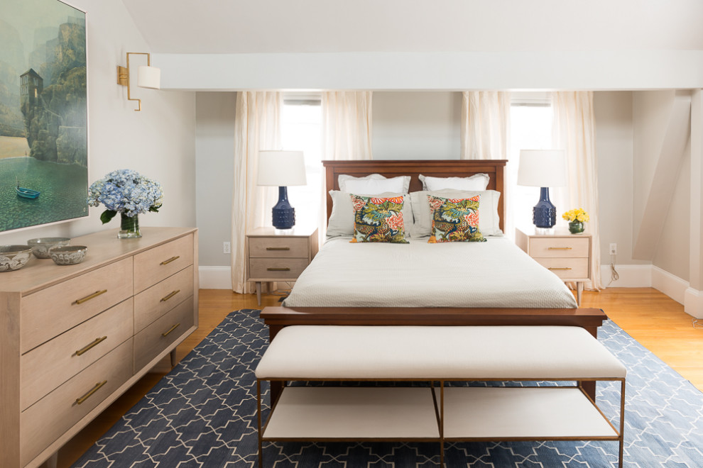 Inspiration for a traditional bedroom in Boston with grey walls, medium hardwood flooring and brown floors.