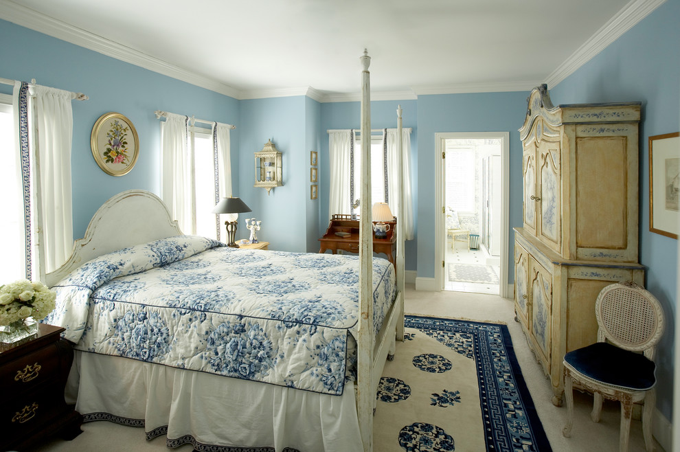 Medium sized rural master bedroom in Other with blue walls, carpet and white floors.