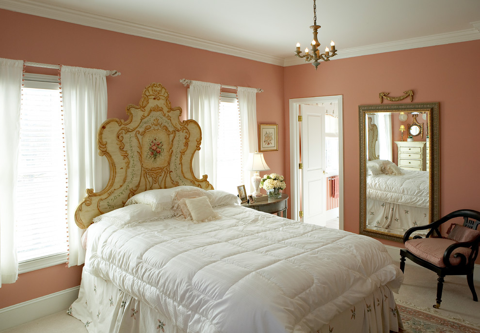 Photo of a medium sized victorian bedroom in Other with pink walls, carpet and beige floors.