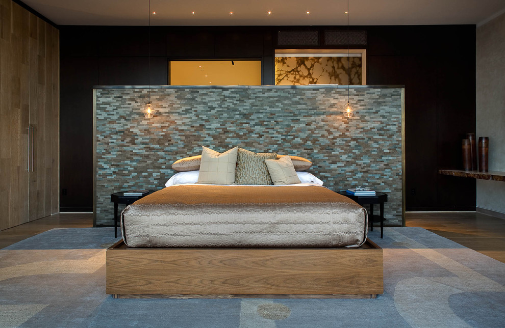 Inspiration for a contemporary medium tone wood floor bedroom remodel in Dallas with black walls and no fireplace