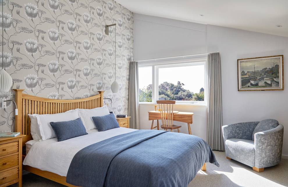Inspiration for a beach style bedroom in Surrey with multi-coloured walls, carpet and grey floors.