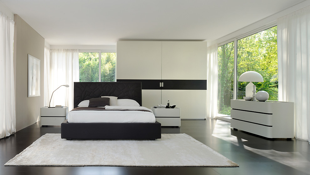 This is an example of a large modern master bedroom in Venice with white walls and no fireplace.
