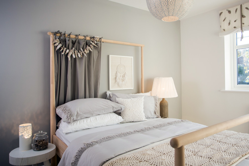This is an example of a scandi guest bedroom in Manchester with grey walls.
