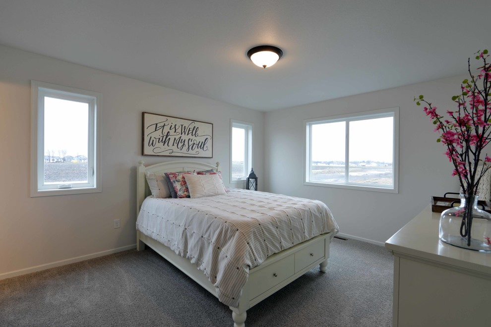 Example of a mid-sized farmhouse carpeted bedroom design in Minneapolis with beige walls
