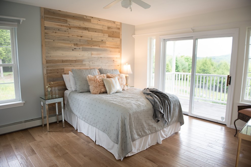 Example of a mid-sized transitional master light wood floor and beige floor bedroom design in Other with gray walls and no fireplace