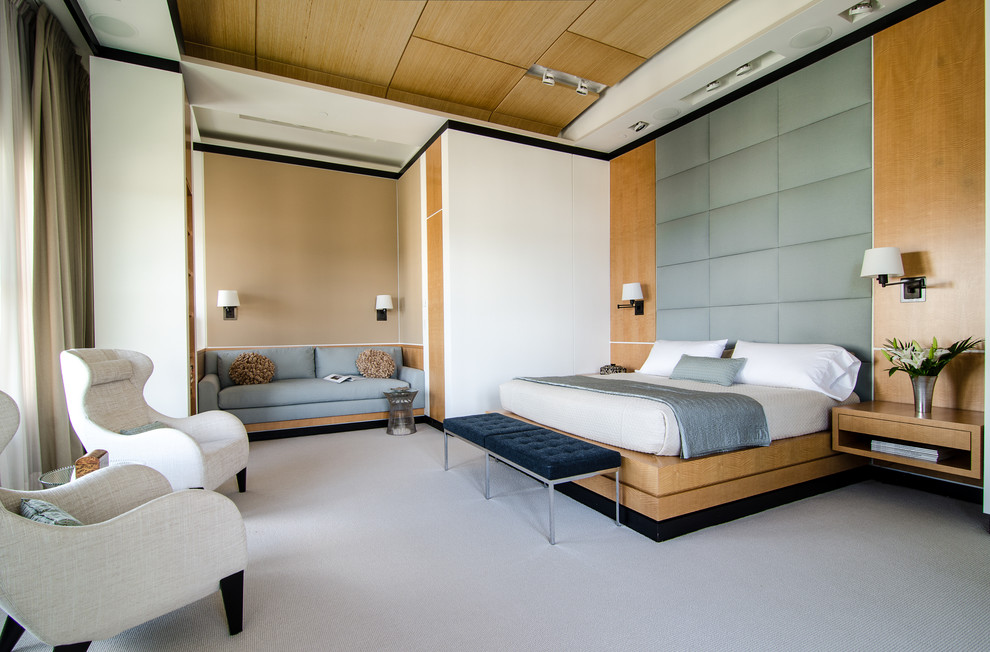 This is an example of a contemporary bedroom in Atlanta with white walls and carpet.