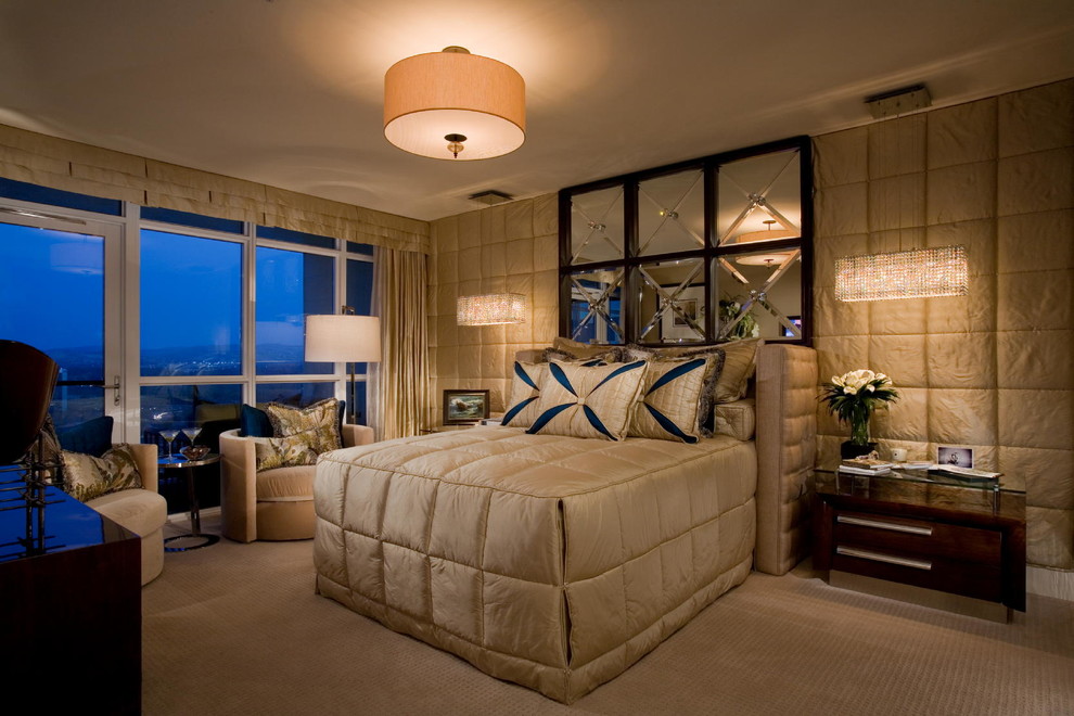 Immagine di una camera da letto design con moquette e nessun camino