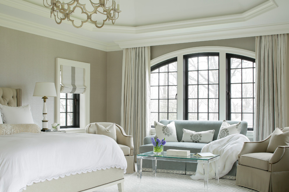 Classic master bedroom in New York with beige walls.
