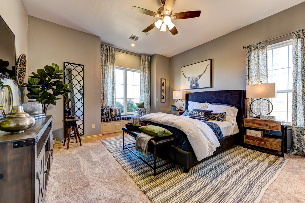 Medium sized rustic guest bedroom in Oklahoma City with grey walls, carpet and beige floors.