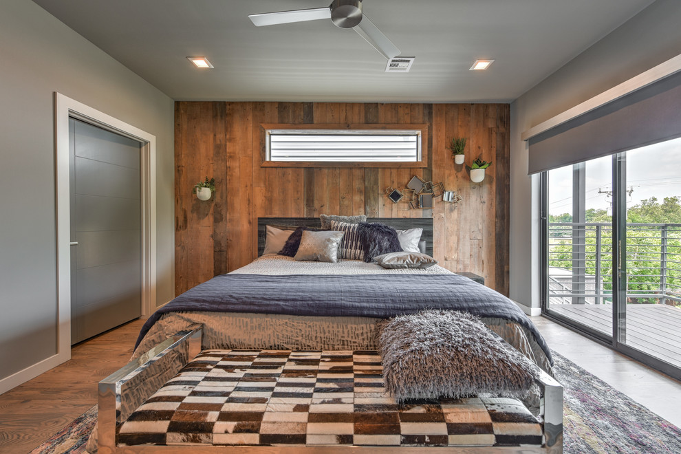 Design ideas for a medium sized modern master bedroom in Oklahoma City with grey walls and medium hardwood flooring.