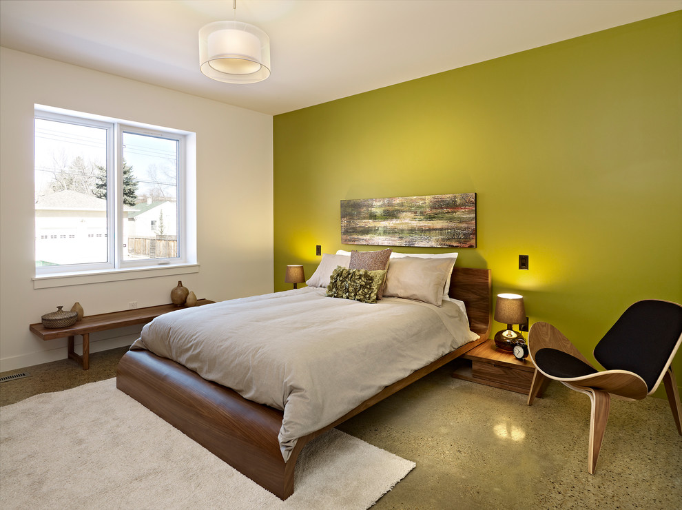 Idee per una camera da letto design con pareti verdi e nessun camino