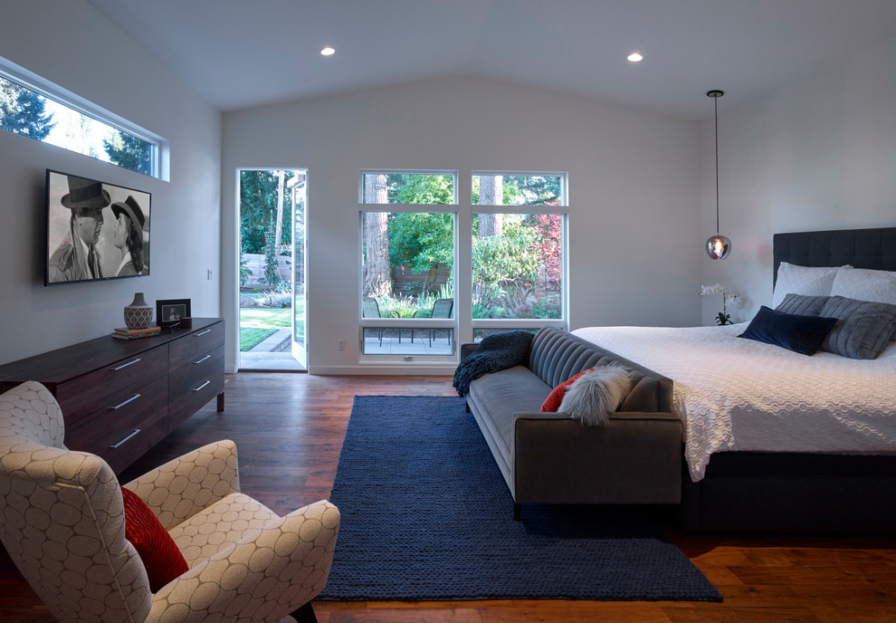 Master bedroom in Seattle with dark hardwood flooring.