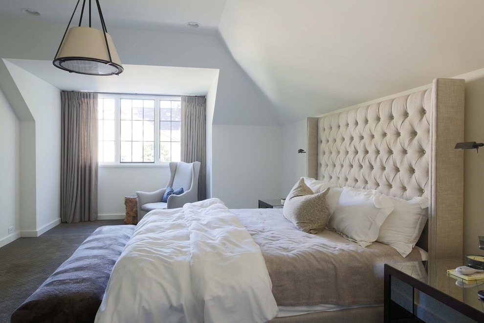 Modern guest bedroom in Charlotte with white walls and carpet.