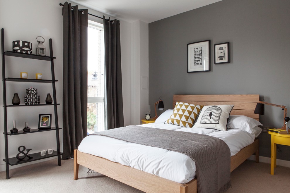 Photo of a bohemian grey and yellow bedroom in London with grey walls.